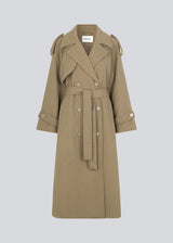 Coat in Dune in trenchcoat style with an oversized silhouette. BorakMD coat is double-breasted with a collar, open yoke, belt at the waist, and a slit in the back. Woolen quality. Lined.