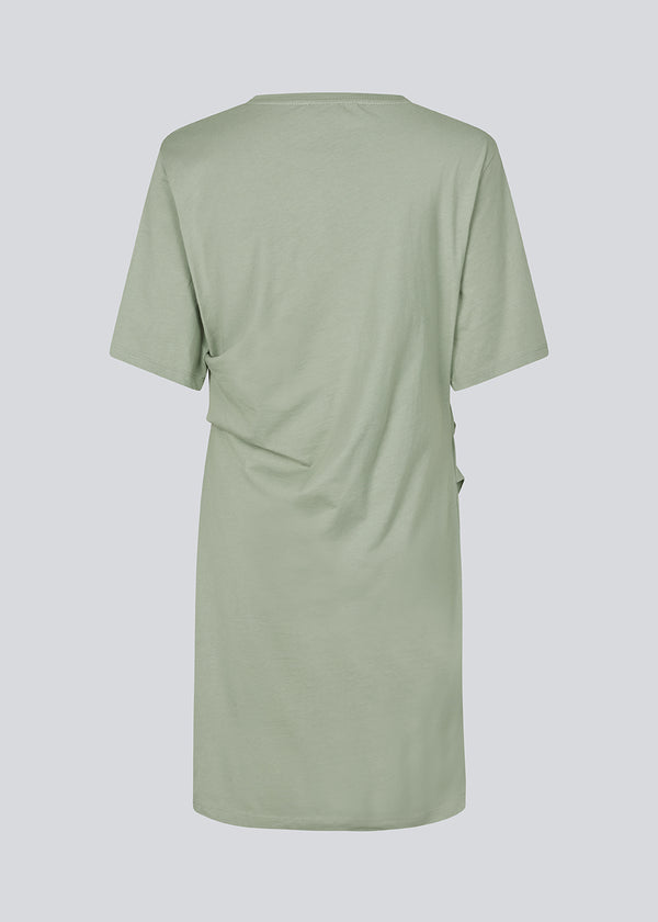 Light green jersey dress with short sleeves. BrazilMD dress has a relaxed fit and gatherings on the side.&nbsp;