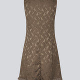 Elegant short dress in textured, patterned fabric. The Briannamd Dress features feminine details such as an A-line silhouette and a ruffle trim, is sleeveless, and designed with a round neckline and a back zip closure. Made from 100% recycled polyester.