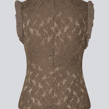 Elegant top in textured, patterned fabric. The Briannamd Top features feminine details such as a tailored fit, is sleeveless with ruffle trim, and designed with a round neckline and a back zip closure. Made from 100% recycled polyester.