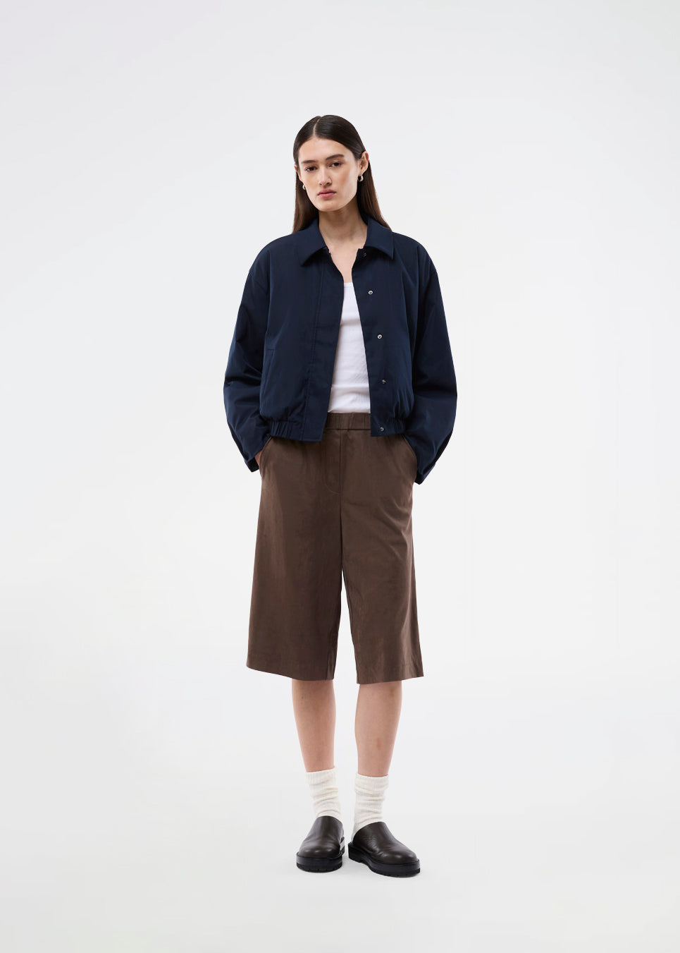Bermuda shorts in soft faux suede. The BritneyMD Long Shorts are a super cool and edgy style with a knee-length cut, relaxed fit, and elastic waistband - a chic and comfortable must-have for effortless summer looks.