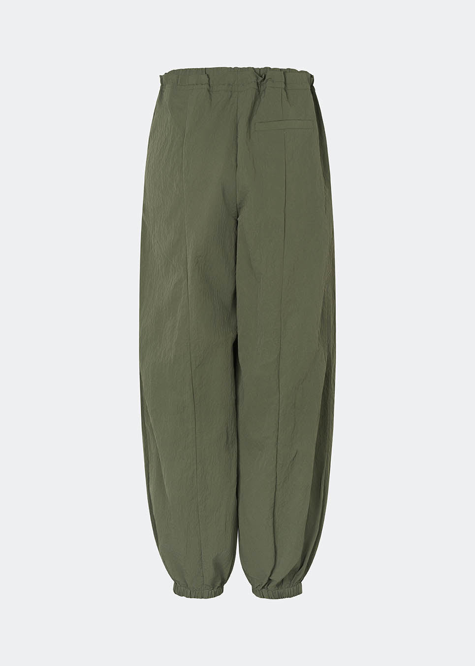 Relaxed trousers with a modern balloon silhouette. Caishamd pants are crafted from a lightweight fabric with an elasticated paperbag waistband and adjustable drawstring for a comfortable fit. The wide legs are gathered with elastic at the ankles, creating a voluminous, contemporary shape. Designed with slanted side pockets and a single welt pocket at the back, they combine functionality with a clean, minimal look. Pair them with a shirt or a lightweight knit for effortless everyday and weekend styling.