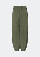 Relaxed trousers with a modern balloon silhouette. Caishamd pants are crafted from a lightweight fabric with an elasticated paperbag waistband and adjustable drawstring for a comfortable fit. The wide legs are gathered with elastic at the ankles, creating a voluminous, contemporary shape. Designed with slanted side pockets and a single welt pocket at the back, they combine functionality with a clean, minimal look. Pair them with a shirt or a lightweight knit for effortless everyday and weekend styling.