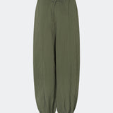 Relaxed trousers with a modern balloon silhouette. Caishamd pants are crafted from a lightweight fabric with an elasticated paperbag waistband and adjustable drawstring for a comfortable fit. The wide legs are gathered with elastic at the ankles, creating a voluminous, contemporary shape. Designed with slanted side pockets and a single welt pocket at the back, they combine functionality with a clean, minimal look. Pair them with a shirt or a lightweight knit for effortless everyday and weekend styling.
