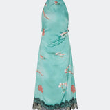 Elegant maxi dress featuring an artistic print and feminine details. Carinamd print dress is crafted from a lightweight, smooth fabric with a high halterneck neckline that fastens at the back of the neck and a self-tie belt at the waist to define the silhouette. The long, flowing fit is finished with a contrasting lace trim at the hem, adding a refined and romantic touch. A standout dress, perfect for summer parties, weddings, and other special occasions.