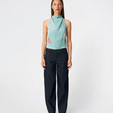 Elegant halterneck top featuring an artistic print and a feminine silhouette. Carinamd print top is crafted from a lightweight, smooth fabric with a high halterneck neckline that fastens at the back of the neck and a tie detail at the back for an adjustable fit. The softly draped design and unique print make it a standout piece for special occasions as well as elevated summer styling.