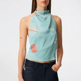 Elegant halterneck top featuring an artistic print and a feminine silhouette. Carinamd print top is crafted from a lightweight, smooth fabric with a high halterneck neckline that fastens at the back of the neck and a tie detail at the back for an adjustable fit. The softly draped design and unique print make it a standout piece for special occasions as well as elevated summer styling.