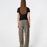 Jeans featuring a bold camouflage print and a relaxed straight-leg fit. CartonMD Print Jeans are designed with a high waist, classic five-pocket styling, belt loops, and a zip fly with button closure. The all-over print creates a modern statement look, while the straight silhouette makes them easy to style for both everyday wear and seasonal trends.