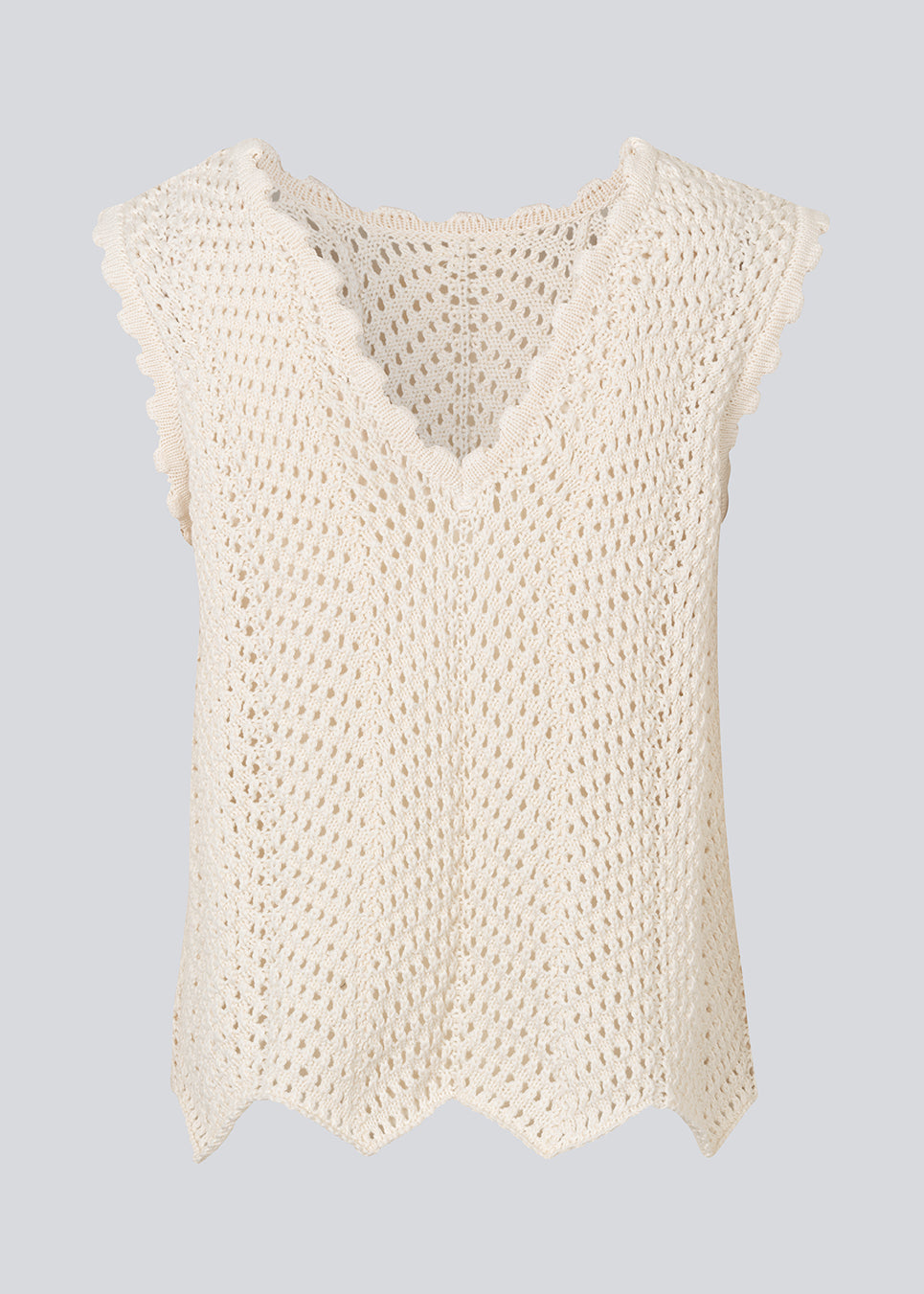 Crochet top without sleeves in a multicolored organic cotton. CaryMD top has detailed trimmings and a deep v-neckline in the back. 