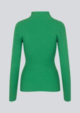 Slim fitted long sleeved top in green in a stretchy rib knit with a high neck. Made from more responsible materials.  The model is 177 cm and wears a size S/36.