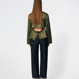 Elegant satin blouse with a feminine and contemporary look. Cianomd top is crafted from a lustrous satin fabric with long sleeves, a boat neckline, and a striking open-back detail finished with delicate tie fastening. A refined wardrobe staple that pairs effortlessly with tailored trousers, denim, or occasion-ready skirts.