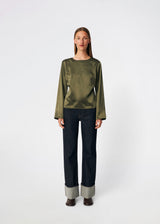 Elegant satin blouse with a feminine and contemporary look. Cianomd top is crafted from a lustrous satin fabric with long sleeves, a boat neckline, and a striking open-back detail finished with delicate tie fastening. A refined wardrobe staple that pairs effortlessly with tailored trousers, denim, or occasion-ready skirts.