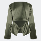 Elegant satin blouse with a feminine and contemporary look. Cianomd top is crafted from a lustrous satin fabric with long sleeves, a boat neckline, and a striking open-back detail finished with delicate tie fastening. A refined wardrobe staple that pairs effortlessly with tailored trousers, denim, or occasion-ready skirts.