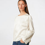 Elegant satin blouse with a feminine and contemporary look. Cianomd top is crafted from a lustrous satin fabric with long sleeves, a boat neckline, and a striking open-back detail finished with delicate tie fastening. A refined wardrobe staple that pairs effortlessly with tailored trousers, denim, or occasion-ready skirts.