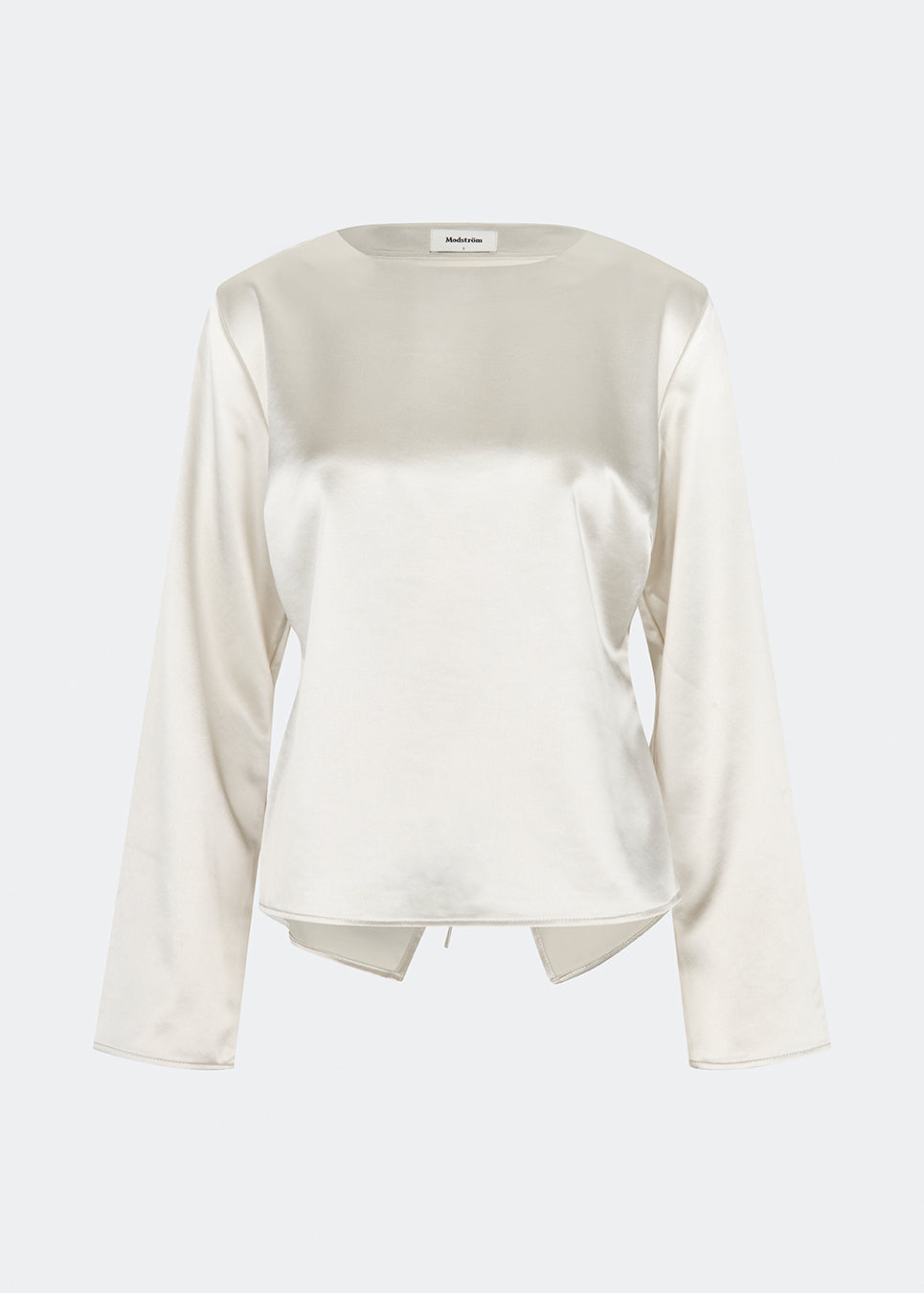 Elegant satin blouse with a feminine and contemporary look. Cianomd top is crafted from a lustrous satin fabric with long sleeves, a boat neckline, and a striking open-back detail finished with delicate tie fastening. A refined wardrobe staple that pairs effortlessly with tailored trousers, denim, or occasion-ready skirts.