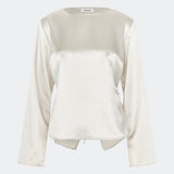Elegant satin blouse with a feminine and contemporary look. Cianomd top is crafted from a lustrous satin fabric with long sleeves, a boat neckline, and a striking open-back detail finished with delicate tie fastening. A refined wardrobe staple that pairs effortlessly with tailored trousers, denim, or occasion-ready skirts.
