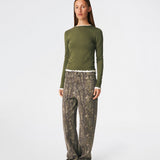 Long-sleeved T-shirt crafted from a soft and comfortable fabric. CiljaMD LS T-shirt features a fitted silhouette with a crew neckline and contrasting trims at the neckline, cuffs, and hem, creating a layered look. The delicate lettuce-edge finish adds a feminine touch, making it perfect to wear on its own or layered under knitwear, shirts, or jackets.