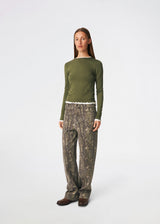 Long-sleeved T-shirt crafted from a soft and comfortable fabric. CiljaMD LS T-shirt features a fitted silhouette with a crew neckline and contrasting trims at the neckline, cuffs, and hem, creating a layered look. The delicate lettuce-edge finish adds a feminine touch, making it perfect to wear on its own or layered under knitwear, shirts, or jackets.