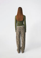 Long-sleeved T-shirt crafted from a soft and comfortable fabric. CiljaMD LS T-shirt features a fitted silhouette with a crew neckline and contrasting trims at the neckline, cuffs, and hem, creating a layered look. The delicate lettuce-edge finish adds a feminine touch, making it perfect to wear on its own or layered under knitwear, shirts, or jackets.