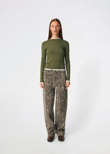 Long-sleeved T-shirt crafted from a soft and comfortable fabric. CiljaMD LS T-shirt features a fitted silhouette with a crew neckline and contrasting trims at the neckline, cuffs, and hem, creating a layered look. The delicate lettuce-edge finish adds a feminine touch, making it perfect to wear on its own or layered under knitwear, shirts, or jackets.