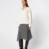 Soft and feminine knitted sweater with delicate crochet detailing. Cillamd V-neck is designed in a relaxed fit with a V-neckline, wide collar, and decorative crochet panels across the shoulders for a romantic touch. The voluminous sleeves and soft knit quality make it a comfortable wardrobe favourite that pairs effortlessly with jeans, tailored trousers, and skirts.
