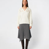 Soft and feminine knitted sweater with delicate crochet detailing. Cillamd V-neck is designed in a relaxed fit with a V-neckline, wide collar, and decorative crochet panels across the shoulders for a romantic touch. The voluminous sleeves and soft knit quality make it a comfortable wardrobe favourite that pairs effortlessly with jeans, tailored trousers, and skirts.