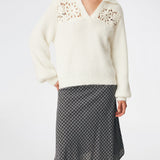 Soft and feminine knitted sweater with delicate crochet detailing. Cillamd V-neck is designed in a relaxed fit with a V-neckline, wide collar, and decorative crochet panels across the shoulders for a romantic touch. The voluminous sleeves and soft knit quality make it a comfortable wardrobe favourite that pairs effortlessly with jeans, tailored trousers, and skirts.