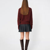 Pleated mini skirt with a modern, preppy aesthetic. Cirkelinemd skirt features a low-rise waist with a wrap-inspired design, decorative strap detail, and crisp pleats that create beautiful movement and volume. The mini length and tailored silhouette make it a versatile piece for both everyday styling and more elevated occasions. Pair it with a shirt, knitwear, or a simple top for a timeless look.