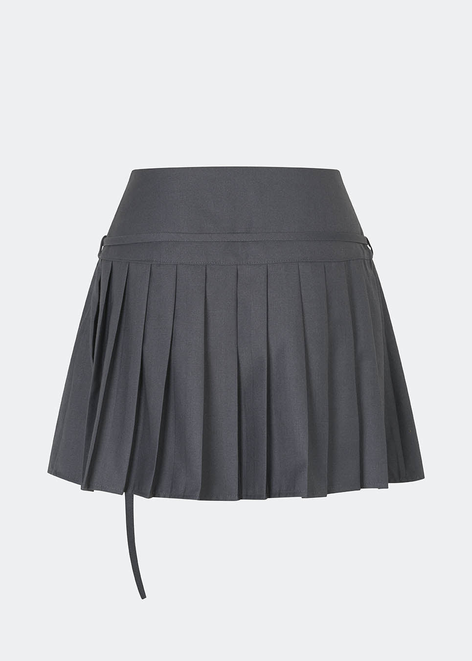 Pleated mini skirt with a modern, preppy aesthetic. Cirkelinemd skirt features a low-rise waist with a wrap-inspired design, decorative strap detail, and crisp pleats that create beautiful movement and volume. The mini length and tailored silhouette make it a versatile piece for both everyday styling and more elevated occasions. Pair it with a shirt, knitwear, or a simple top for a timeless look.