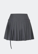 Pleated mini skirt with a modern, preppy aesthetic. Cirkelinemd skirt features a low-rise waist with a wrap-inspired design, decorative strap detail, and crisp pleats that create beautiful movement and volume. The mini length and tailored silhouette make it a versatile piece for both everyday styling and more elevated occasions. Pair it with a shirt, knitwear, or a simple top for a timeless look.