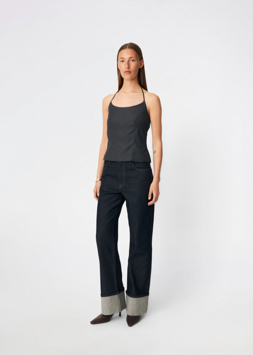 Elegant halterneck top with a modern look. Cirkelinemd top is made from 80% recycled polyester and designed with a flattering fit, a halterneck neckline, and a striking open back with adjustable straps. The feminine silhouette makes it perfect for both special occasions and elevated everyday styling.