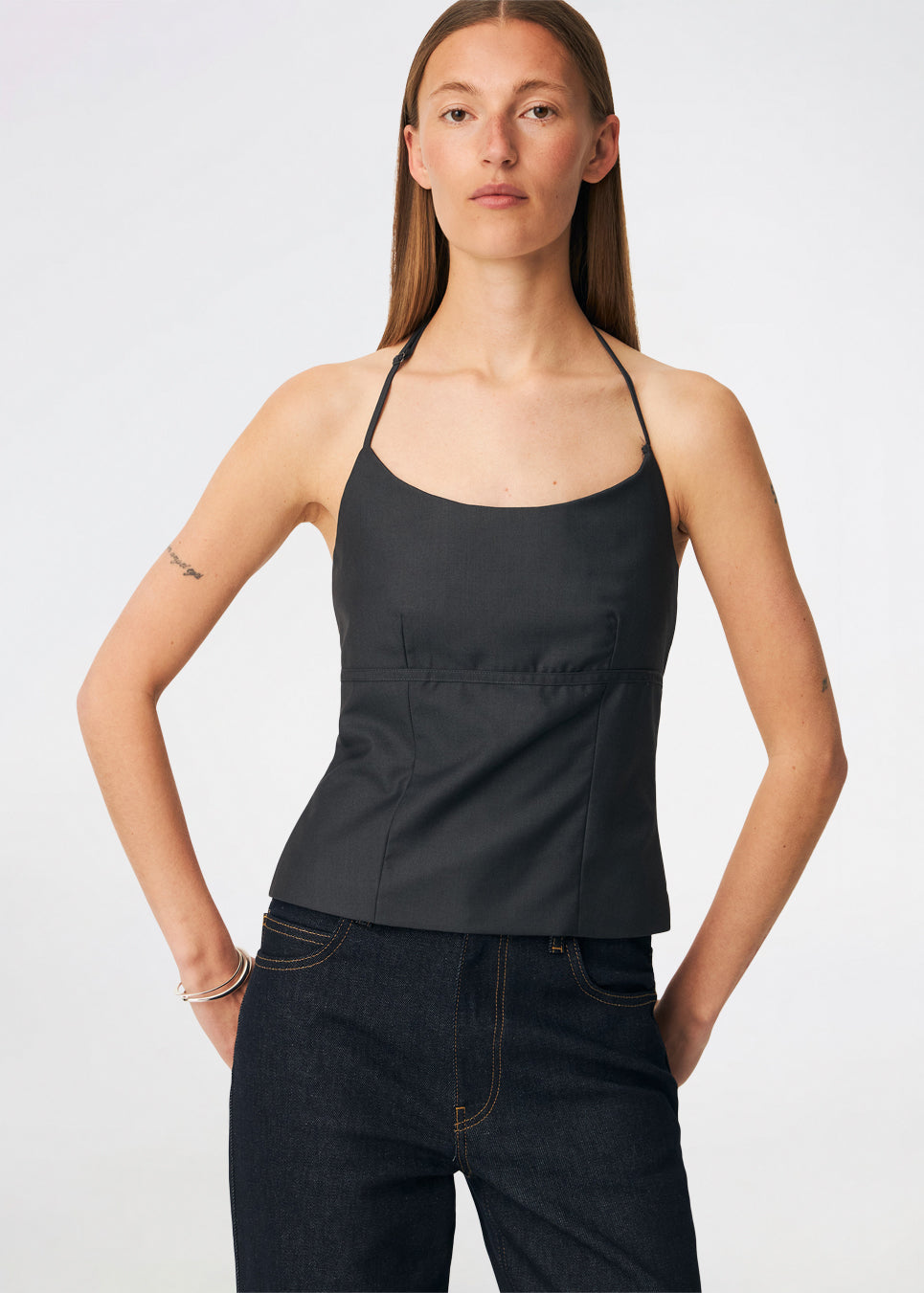 Elegant halterneck top with a modern look. Cirkelinemd top is made from 80% recycled polyester and designed with a flattering fit, a halterneck neckline, and a striking open back with adjustable straps. The feminine silhouette makes it perfect for both special occasions and elevated everyday styling.
