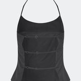 Elegant halterneck top with a modern look. Cirkelinemd top is made from 80% recycled polyester and designed with a flattering fit, a halterneck neckline, and a striking open back with adjustable straps. The feminine silhouette makes it perfect for both special occasions and elevated everyday styling.