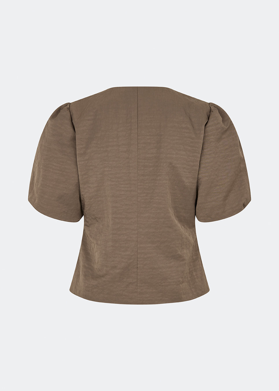 Short-sleeved blazer with a feminine, tailored silhouette. The CirkelMD SS Blazer features a round neckline, short voluminous puff sleeves, and decorative front button closure. Crafted in a lightly textured fabric, it can be worn as both a top and a lightweight jacket, making it ideal for special occasions or an elevated everyday look.