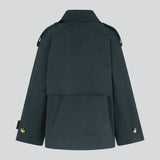 Short trench coat in dar blue in a cotton quality with concealed buttons down the front. Clara jacket has an oversized silhouette and classic details. Lined.