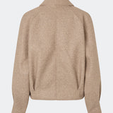 Short jacket with a timeless, sophisticated aesthetic. Cleamd jacket features a relaxed, slightly boxy silhouette with a double-breasted button closure, classic collar, and raglan sleeves for a soft and comfortable fit. Discreet side pockets and clean lines enhance the minimalist design, while the cropped length makes it perfect for both everyday wear and more polished looks.
