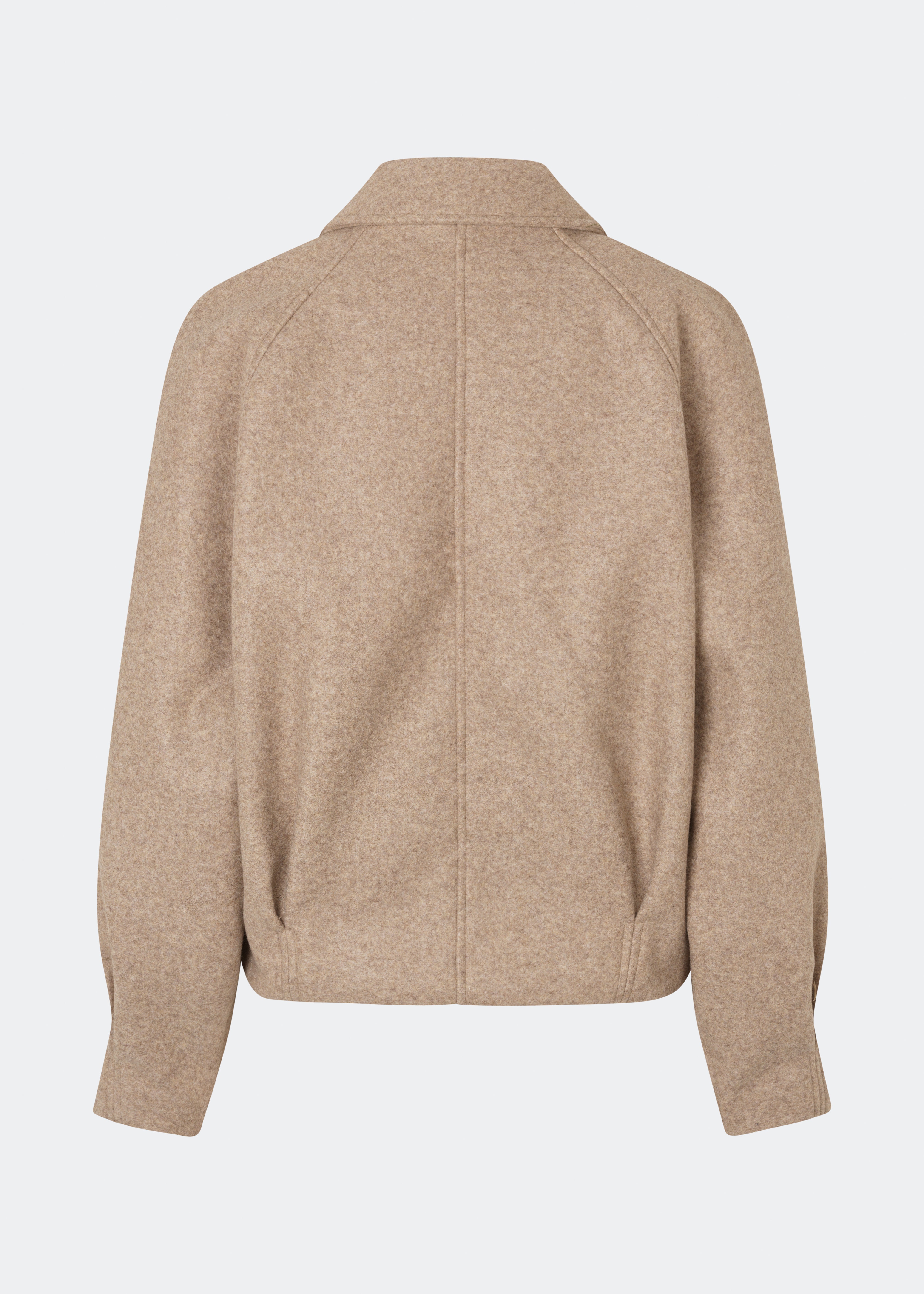Short jacket with a timeless, sophisticated aesthetic. Cleamd jacket features a relaxed, slightly boxy silhouette with a double-breasted button closure, classic collar, and raglan sleeves for a soft and comfortable fit. Discreet side pockets and clean lines enhance the minimalist design, while the cropped length makes it perfect for both everyday wear and more polished looks.