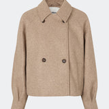 Short jacket with a timeless, sophisticated aesthetic. Cleamd jacket features a relaxed, slightly boxy silhouette with a double-breasted button closure, classic collar, and raglan sleeves for a soft and comfortable fit. Discreet side pockets and clean lines enhance the minimalist design, while the cropped length makes it perfect for both everyday wear and more polished looks.