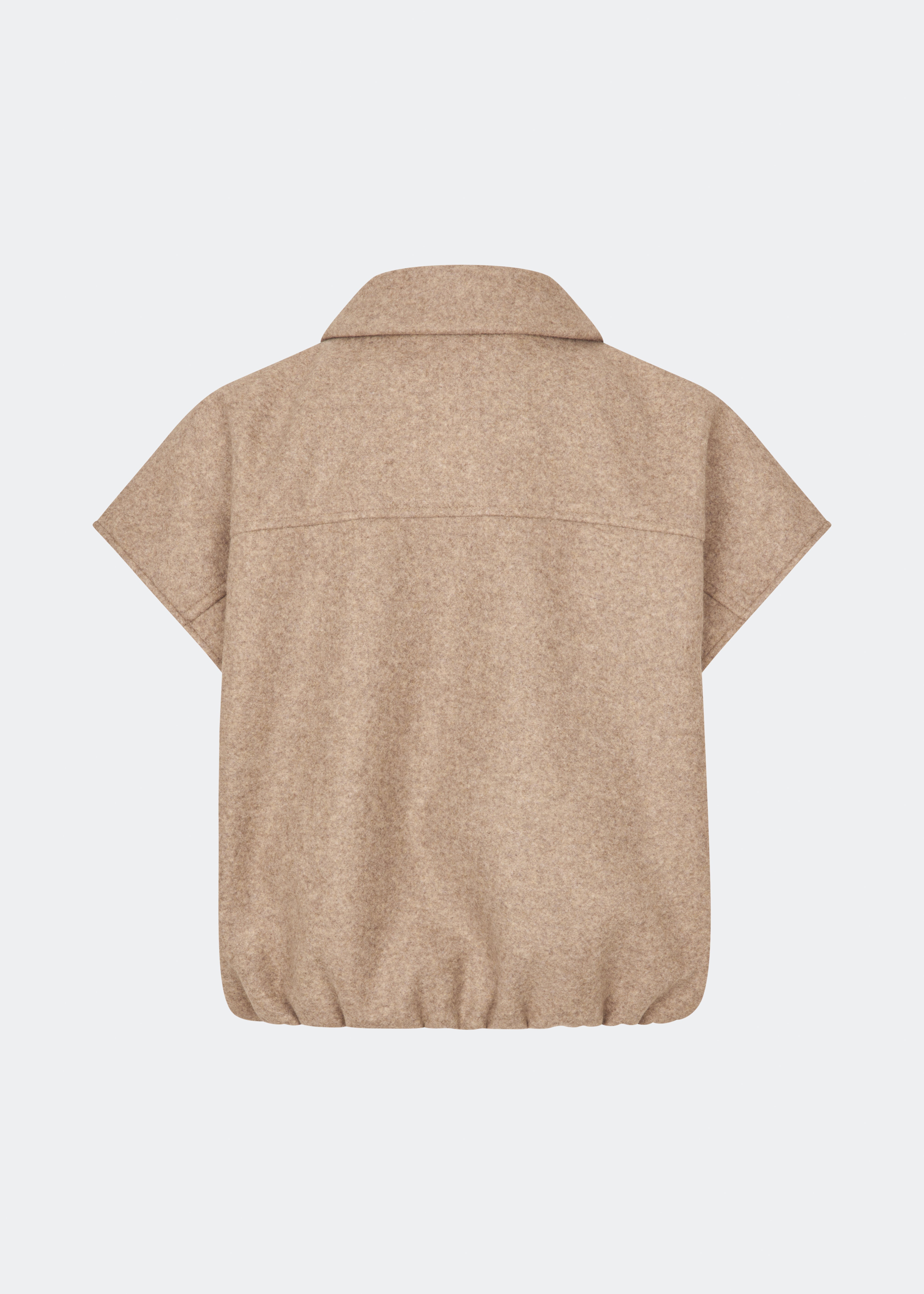 Short vest with a modern, relaxed aesthetic. Cleamd vest features a boxy silhouette with short, wide sleeves, a classic collar, and snap button closure at the front. Discreet front pockets and an elasticated hem create a soft, rounded shape and a comfortable fit. Perfect for layering over knitwear, shirts, or dresses during the transitional seasons.