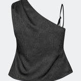 Asymmetric top with a modern and elegant look. Clemensmd top is crafted from a textured fabric with a subtle crinkle finish, adding depth and character. Designed with a one-shoulder silhouette, it features a slim adjustable shoulder strap on one side and a softly fitted shape that flatters the body. A refined statement piece, perfect for special occasions and elevated evening styling.