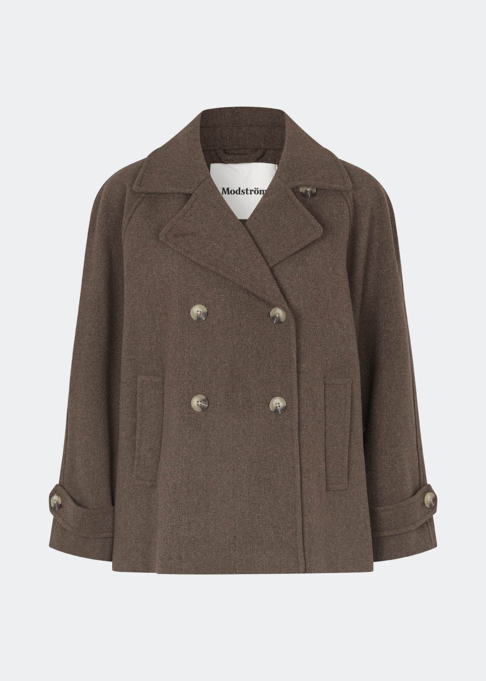 Short double-breasted wool-blend jacket with a wide lapel collar, buttoned cuff straps and raglan sleeves that create a rounded shoulder line. Wear it with denim or a fluid skirt. The model is 175 cm tall and is wearing a size S/36.