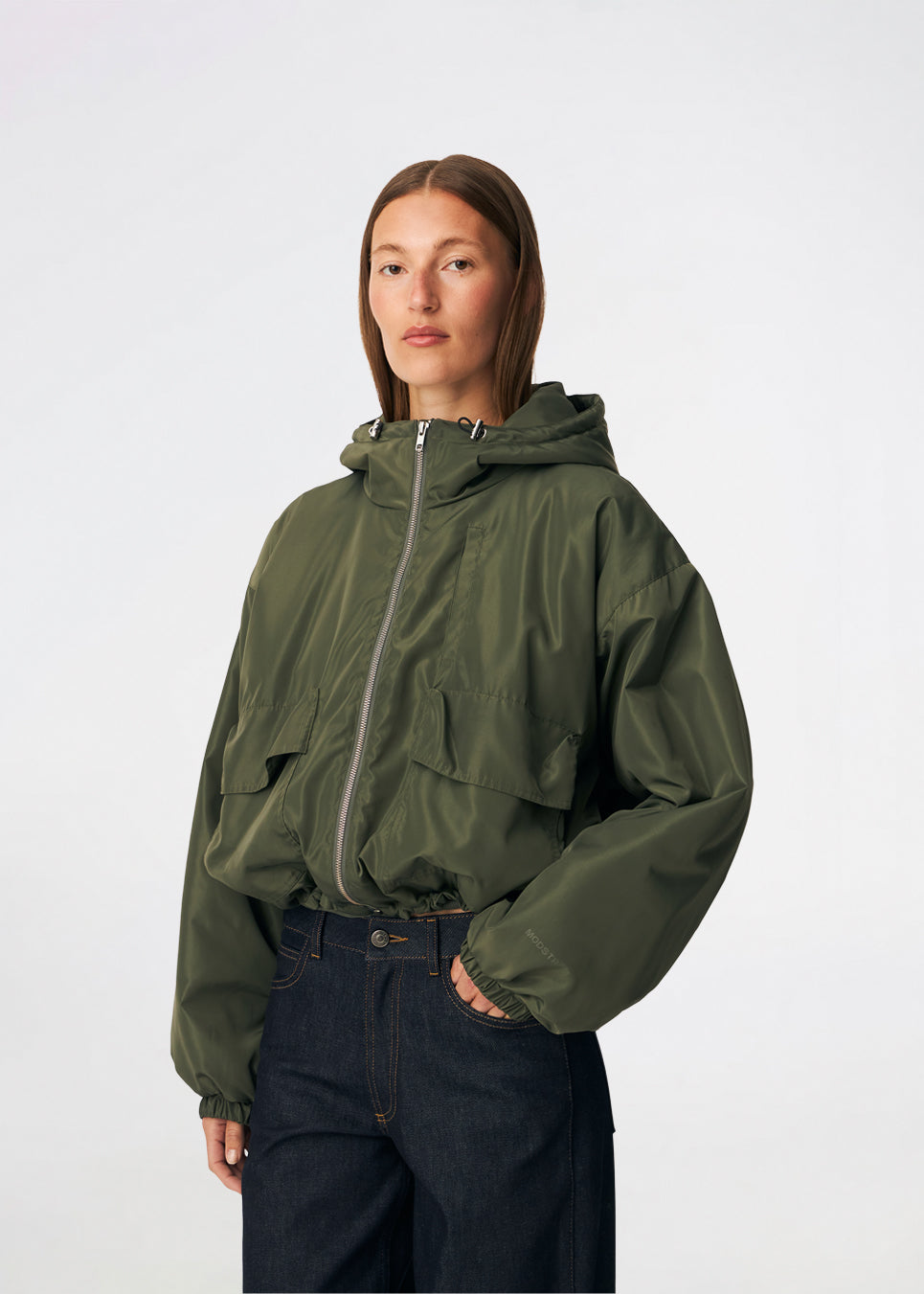 ConnieMD Jacket is a short jacket with a loose fit and hood. The jacket features a zip fastening at the front, large flap pockets and long, voluminous sleeves with elasticated cuffs. The model is 175 cm tall and is wearing a size S/36.