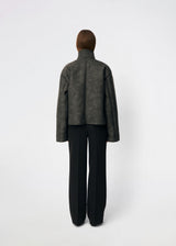Short faux shearling jacket with a modern, timeless aesthetic. Coralinemd jacket features a relaxed silhouette with a high stand collar, front button closure, and decorative seam detailing that enhances its classic design. Soft teddy trims at the cuffs add warmth and contrast, while the slightly oversized fit makes it perfect for layering throughout the colder months.