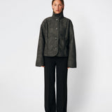 Short faux shearling jacket with a modern, timeless aesthetic. Coralinemd jacket features a relaxed silhouette with a high stand collar, front button closure, and decorative seam detailing that enhances its classic design. Soft teddy trims at the cuffs add warmth and contrast, while the slightly oversized fit makes it perfect for layering throughout the colder months.