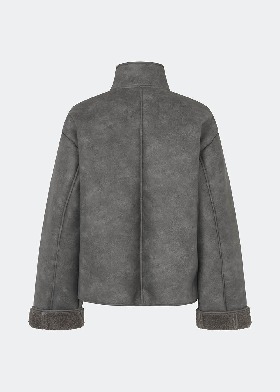Short faux shearling jacket with a modern, timeless aesthetic. Coralinemd jacket features a relaxed silhouette with a high stand collar, front button closure, and decorative seam detailing that enhances its classic design. Soft teddy trims at the cuffs add warmth and contrast, while the slightly oversized fit makes it perfect for layering throughout the colder months.