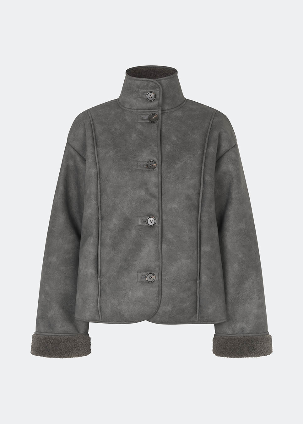 Short faux shearling jacket with a modern, timeless aesthetic. Coralinemd jacket features a relaxed silhouette with a high stand collar, front button closure, and decorative seam detailing that enhances its classic design. Soft teddy trims at the cuffs add warmth and contrast, while the slightly oversized fit makes it perfect for layering throughout the colder months.