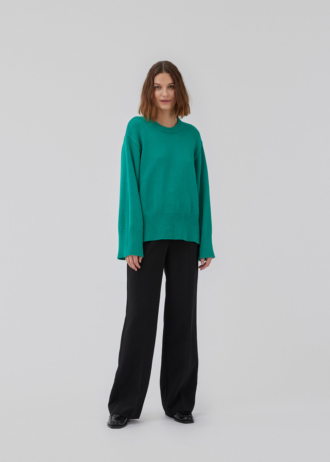 Fine-knitted oversize jumper knitted from cotton. CorbinMD o-neck has ribbed round neckline, long wide sleeves, and wide ribbing at cuffs and hem.