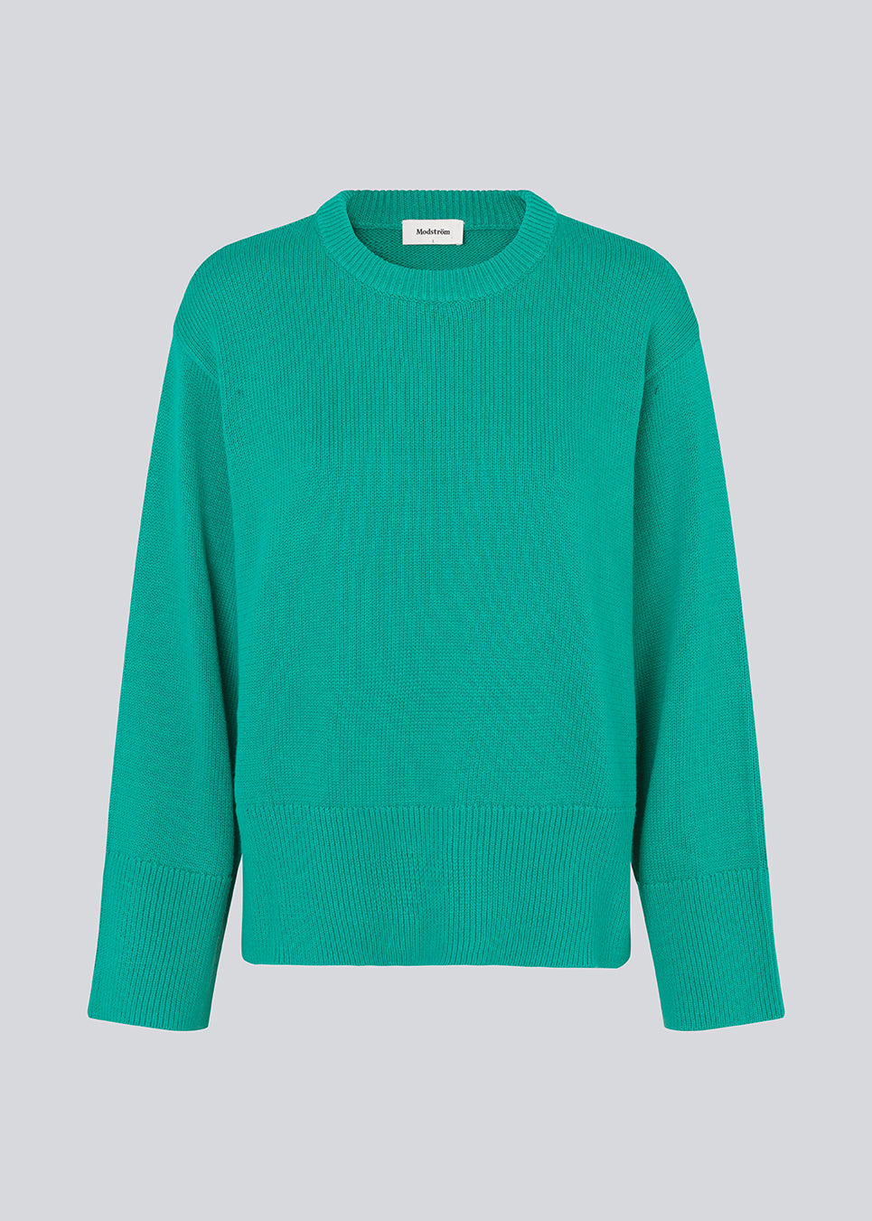 Fine-knitted oversize jumper knitted from cotton. CorbinMD o-neck has ribbed round neckline, long wide sleeves, and wide ribbing at cuffs and hem.