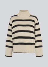 Fine-knitted oversized jumper knitted from cotton in beige with black stripes. CorbinMD stripe t-neck has a ribbed rollneck, long wide sleeves, and wide ribbing at cuffs and hem. 