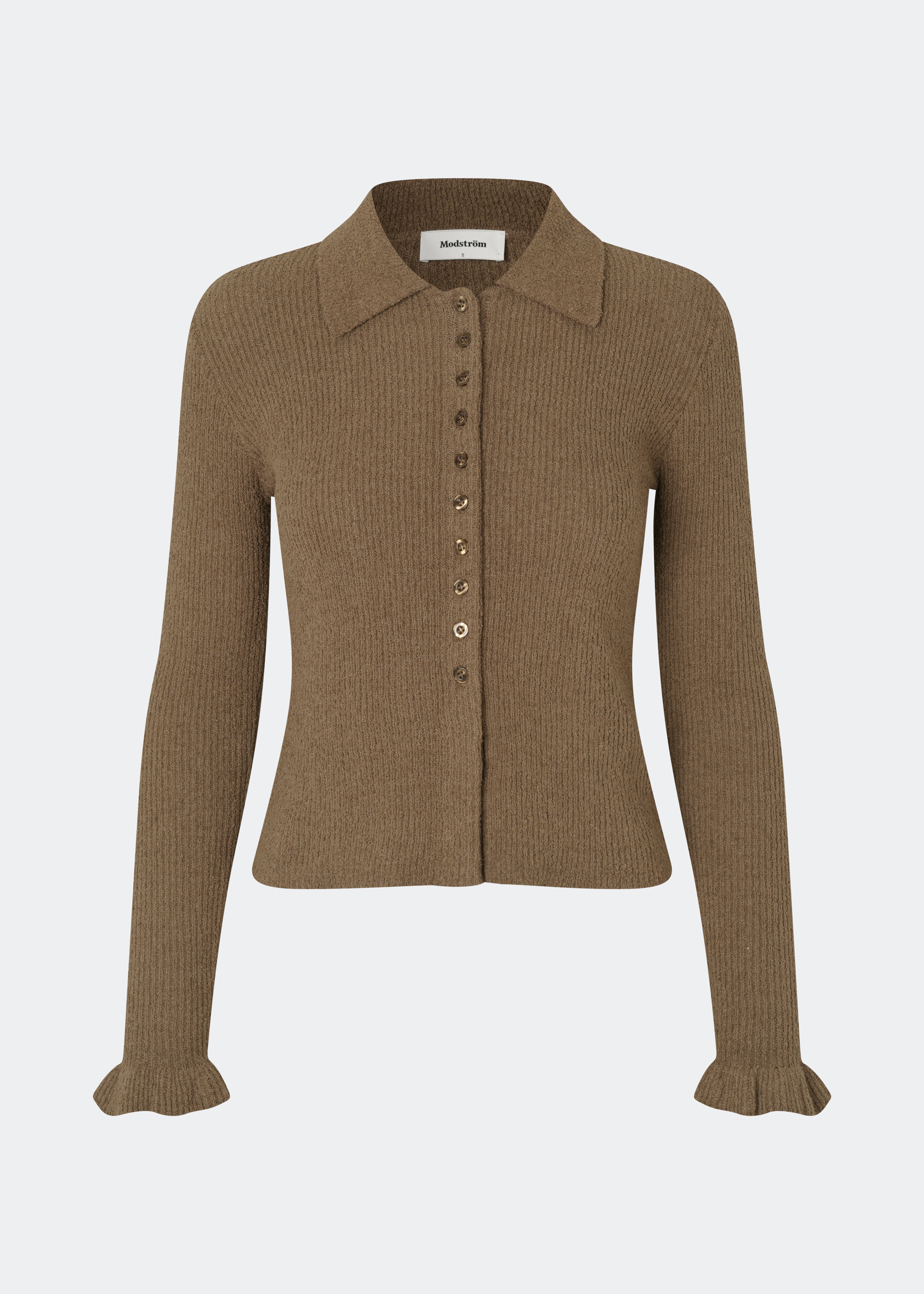 Feminine rib-knit cardigan with elegant details. Corneliamd cardigan is designed in a fitted silhouette with a classic collar, full button-front closure, and delicate ruffle trims at the cuffs. The soft rib-knit enhances the flattering fit, making it a versatile wardrobe staple that can be worn buttoned up as a knit top or layered open over a camisole or dress.